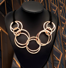 Load image into Gallery viewer, Spiraling Out of COUTURE Copper Necklace and Earrings