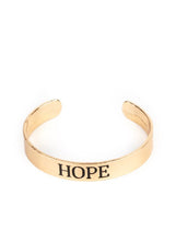 Load image into Gallery viewer, Hope Makes The World Go Round Gold Cuff Bracelet
